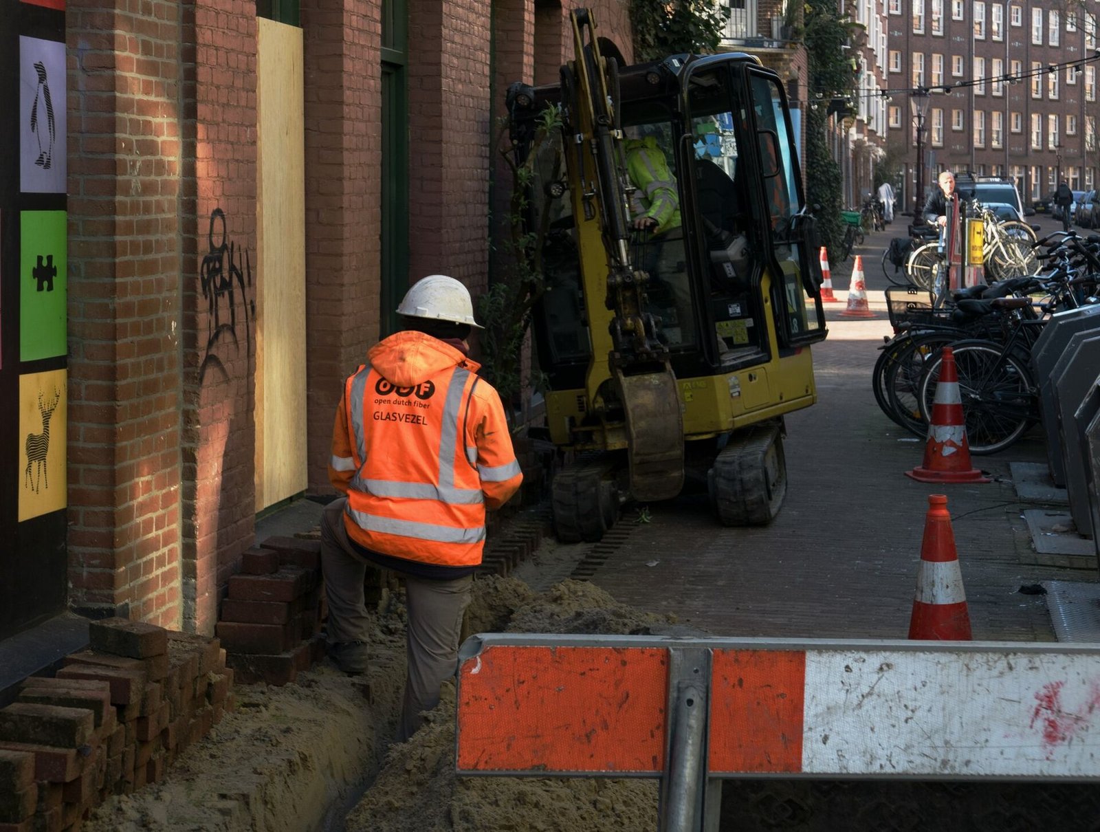 Technicians laying fibre optic cable
